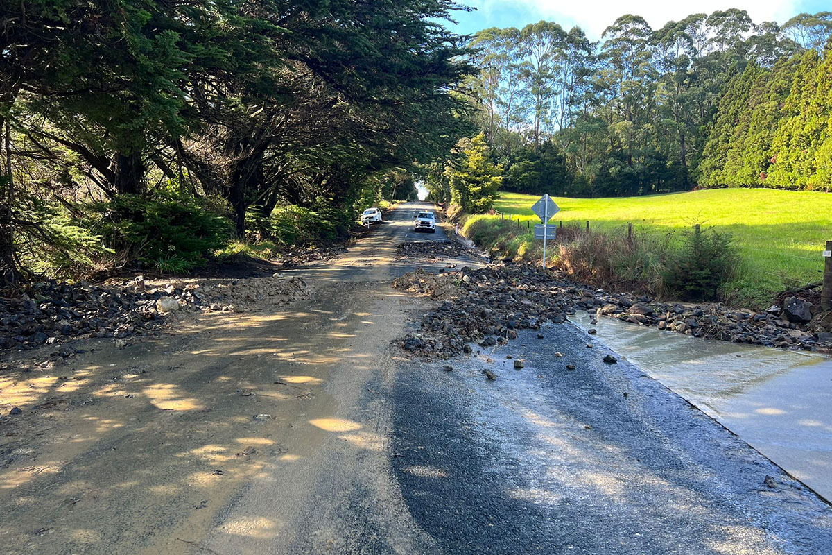 Rocks and mud covering road
